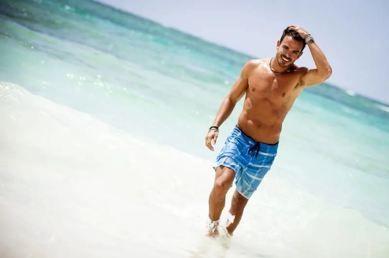 attractive young man on a tropical beach