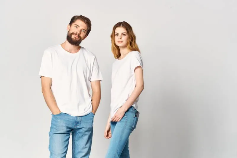 man and woman wearing same outfit with white background