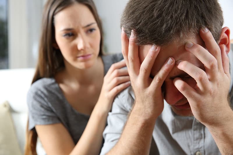 woman comforting crying man