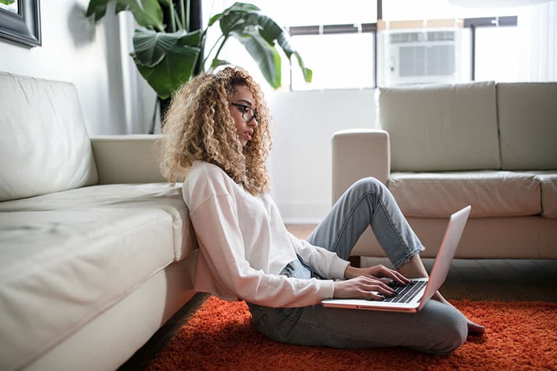 woman working on laptop in the house