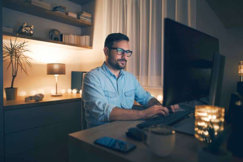 young man working remotely form home