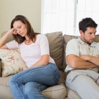 unhappy couple sitting in silence