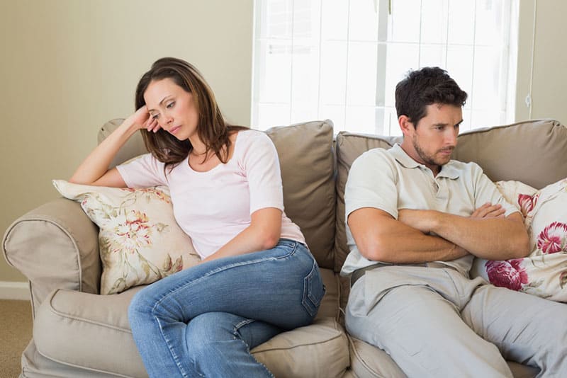 unhappy couple sitting in silence