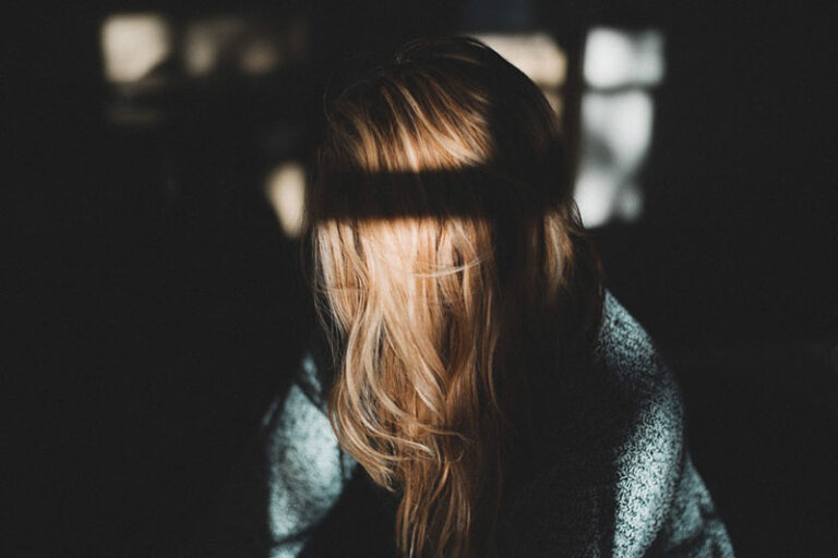 depressed woman in the dark