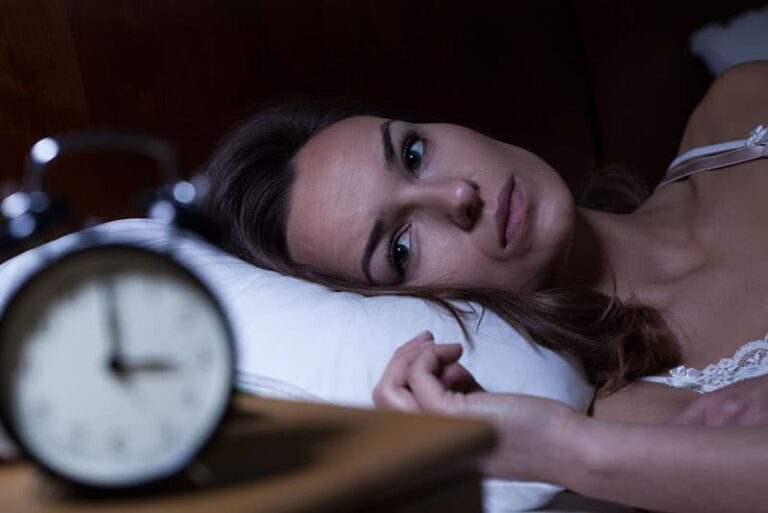 sad woman looking at clock