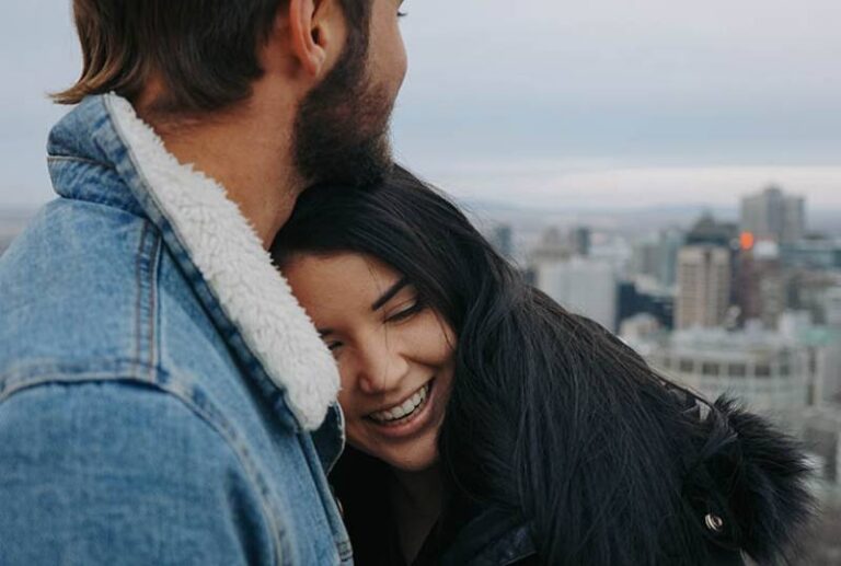 lovely couple hugging outside
