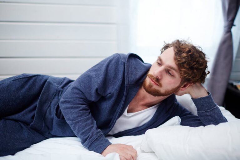man lying in bed