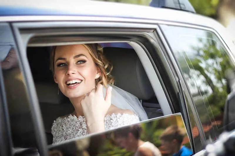 bride sitting in the car