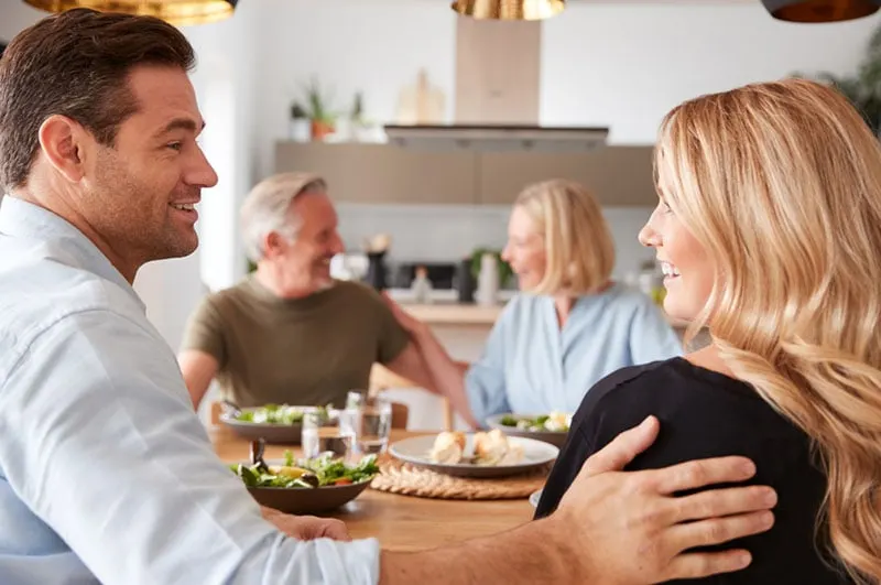 couple having dinner with family