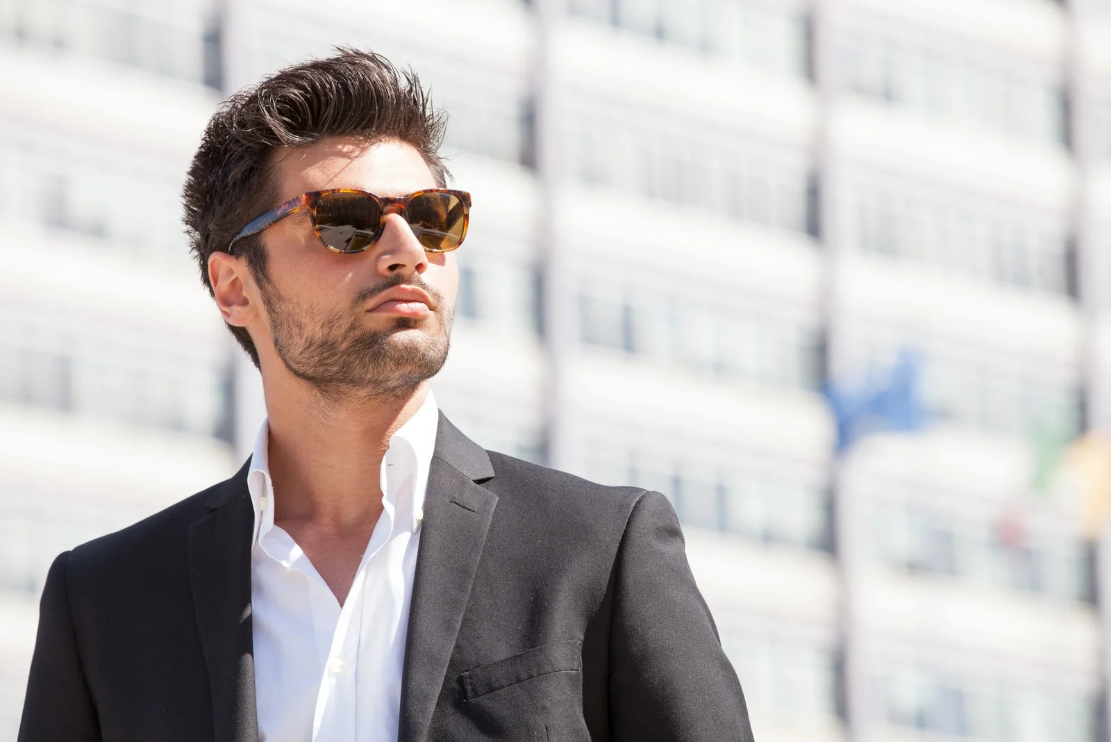 handsome man in suit wearing sunglasses