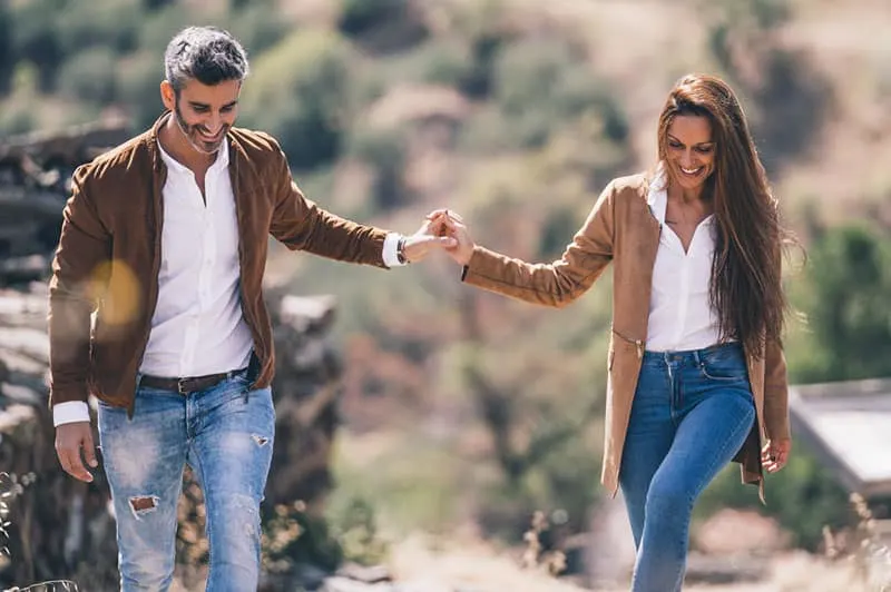 happy couple walking in nature