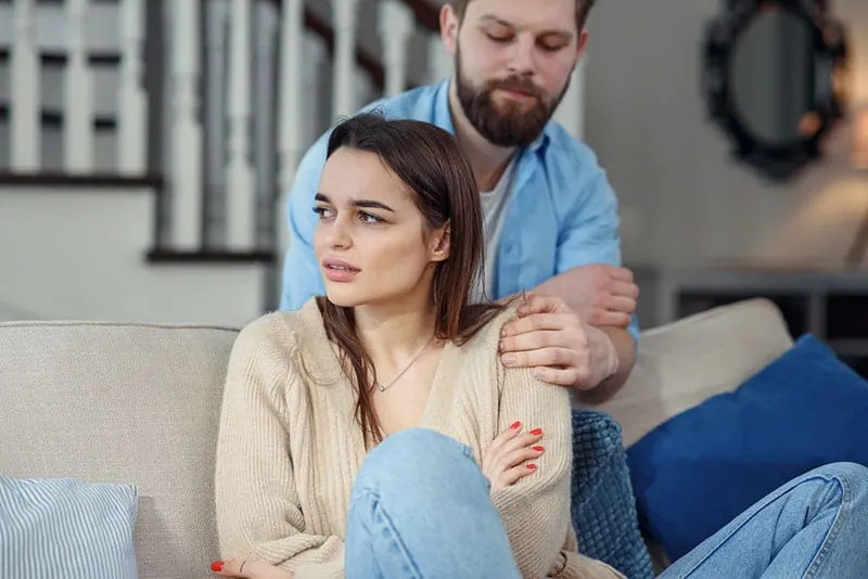 man apologizing to his offended woman