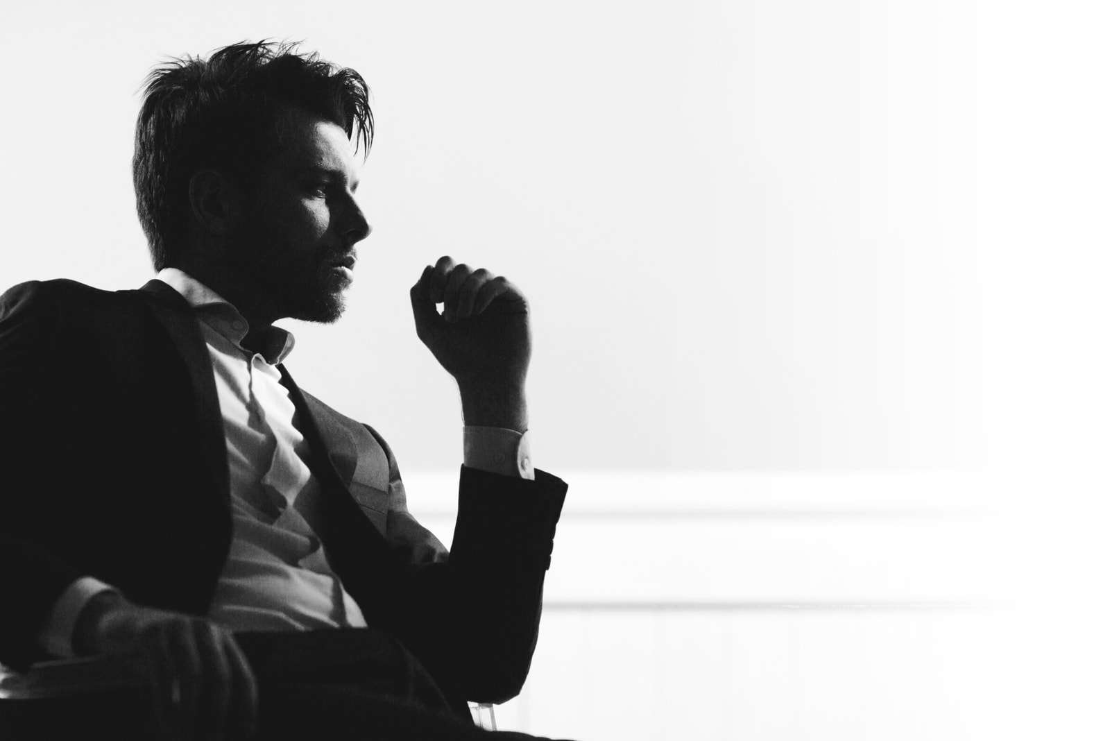 silhouette of a handsome man sitting