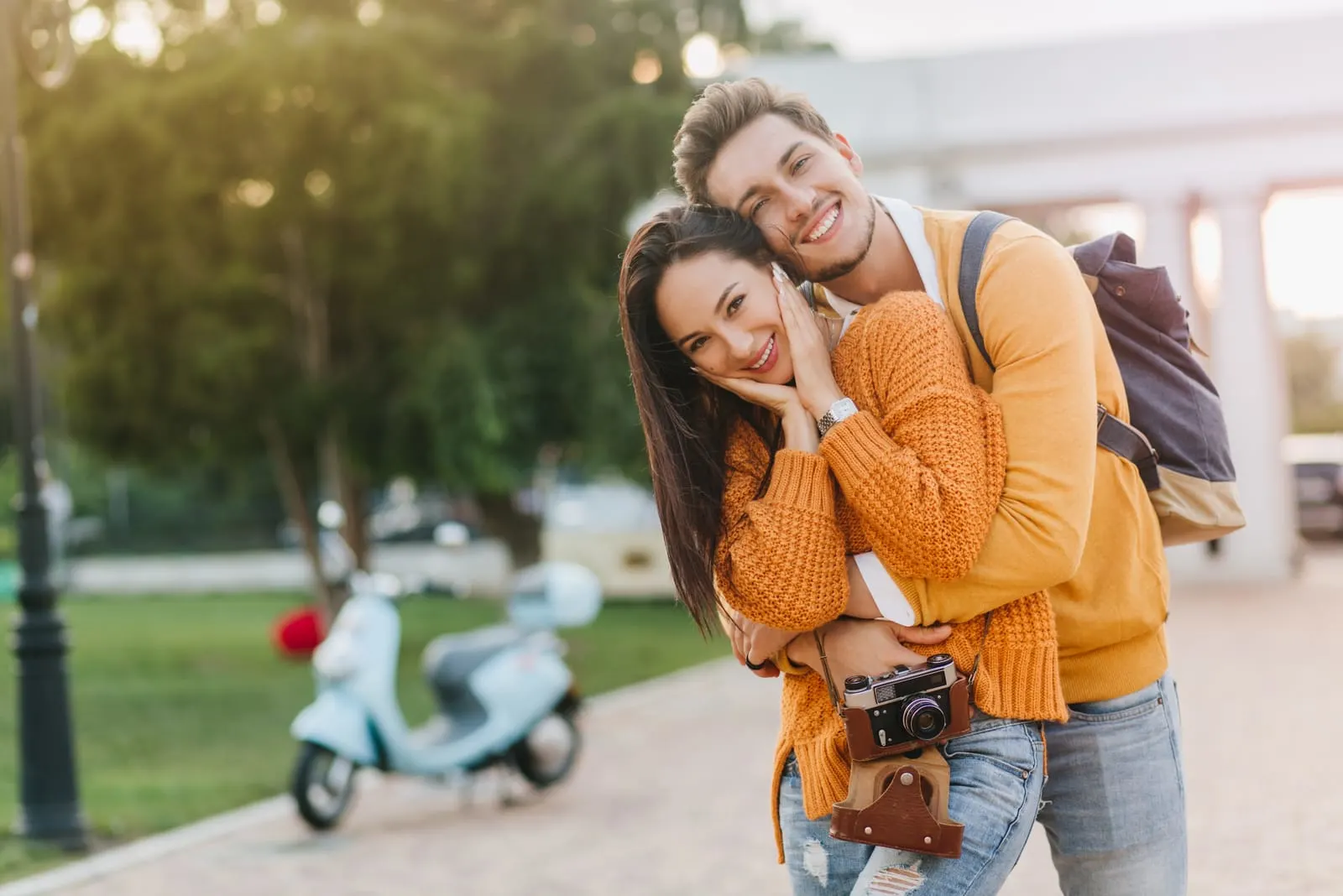 the man hugged the woman and laughed