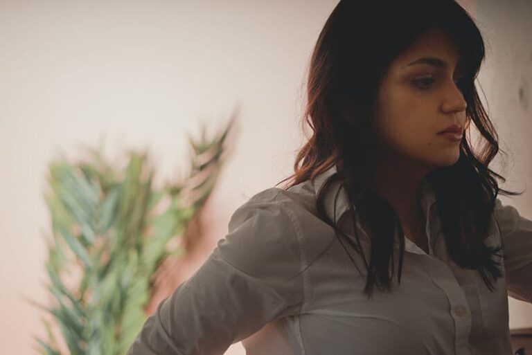 serious woman standing alone