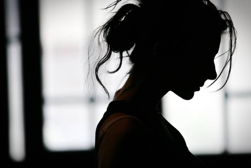 silhouette o sad woman at home