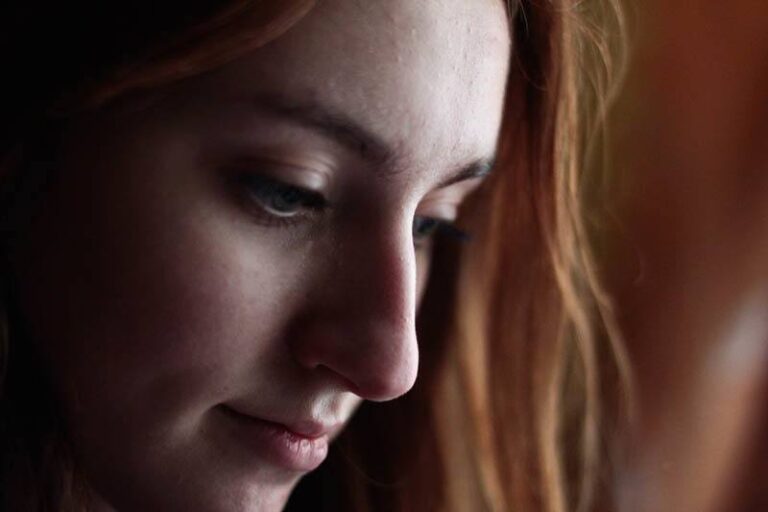 close up photo of sad woman's face