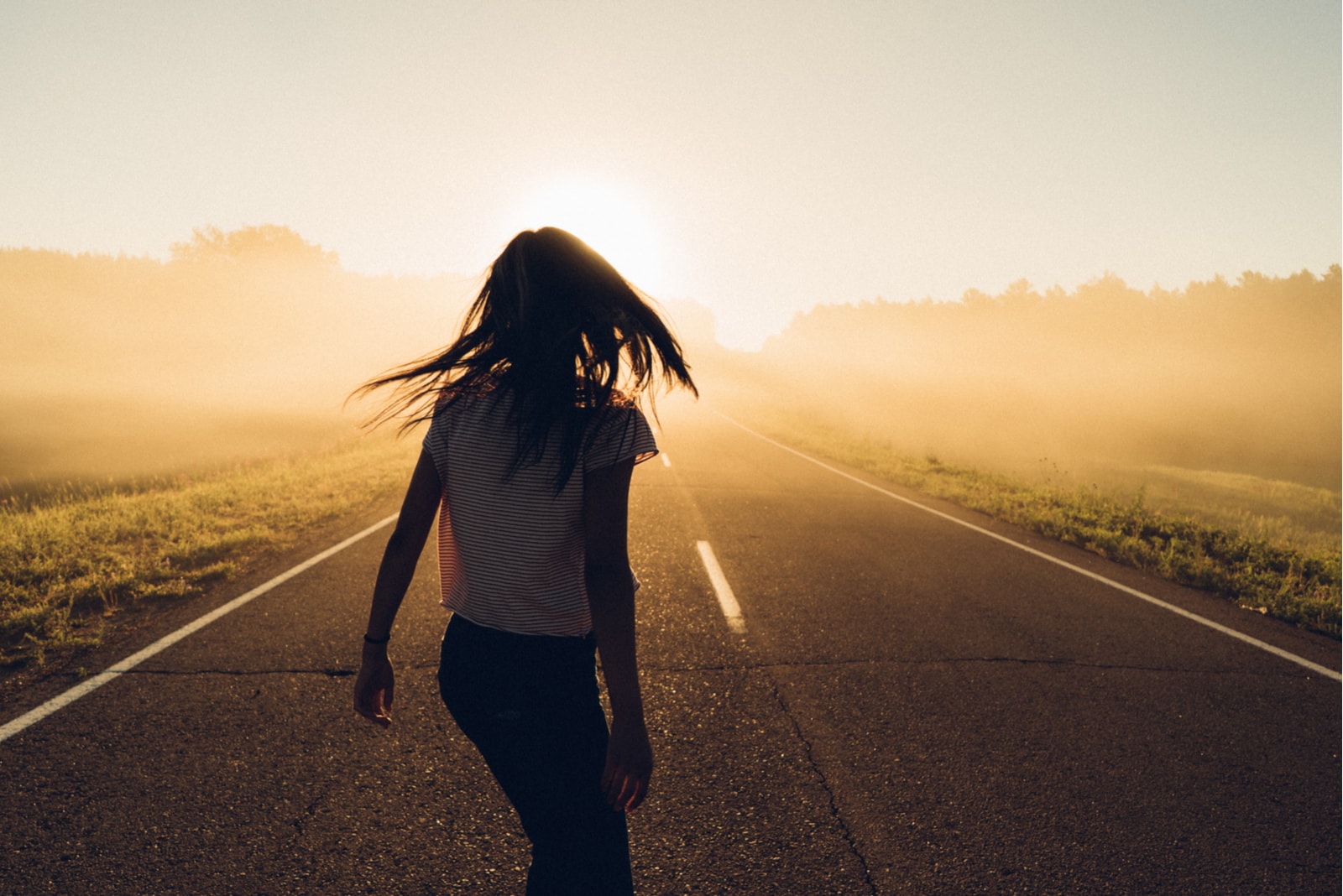 a woman standing in the street