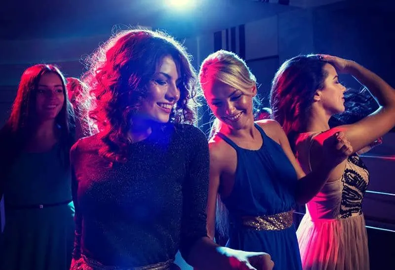 group of female dancing during nighttime