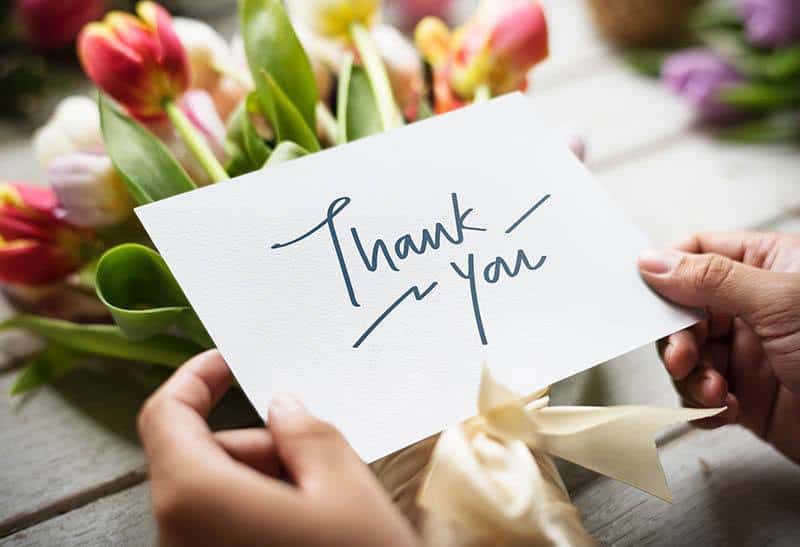 paper with thank you sign