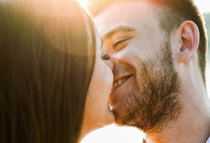 smiling couple kissing