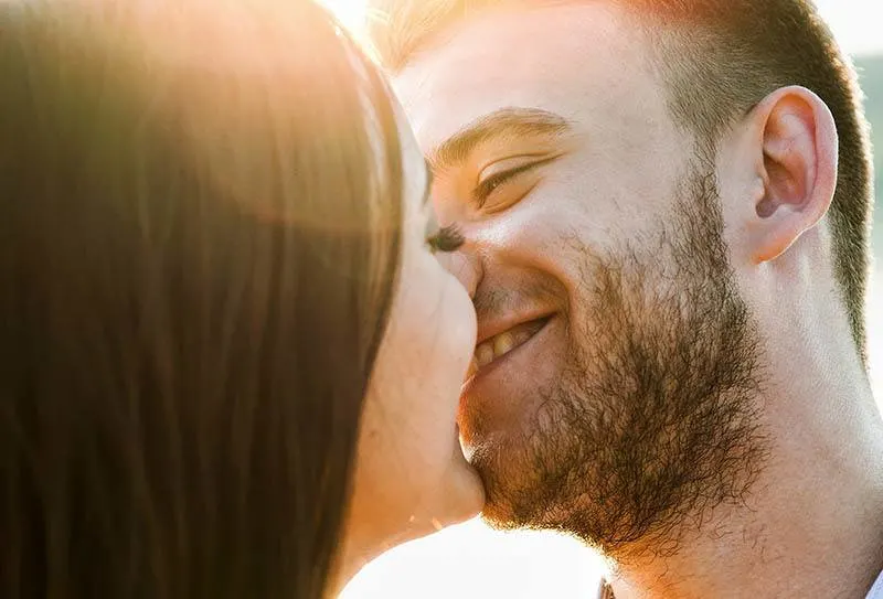 smiling couple kissing