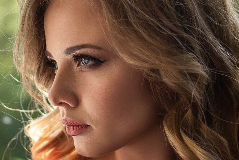 closeup photo of blonde serious woman