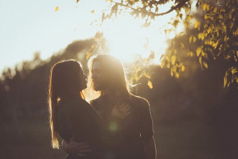 couple standing in sunlight