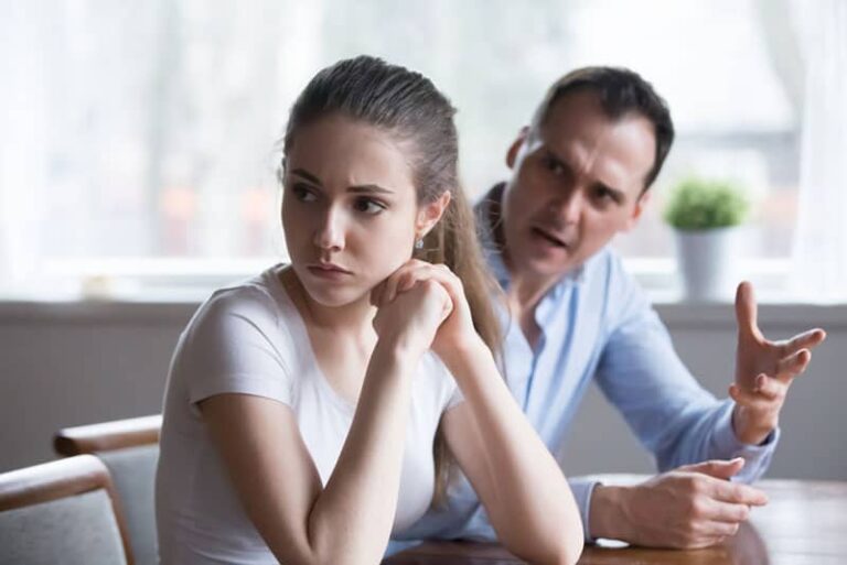 man yelling at sad woman