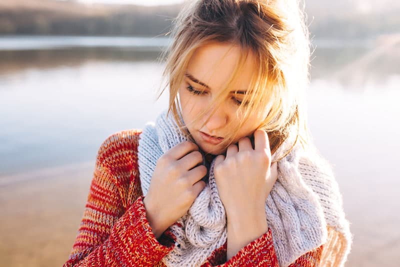 sad woman holding for scarf