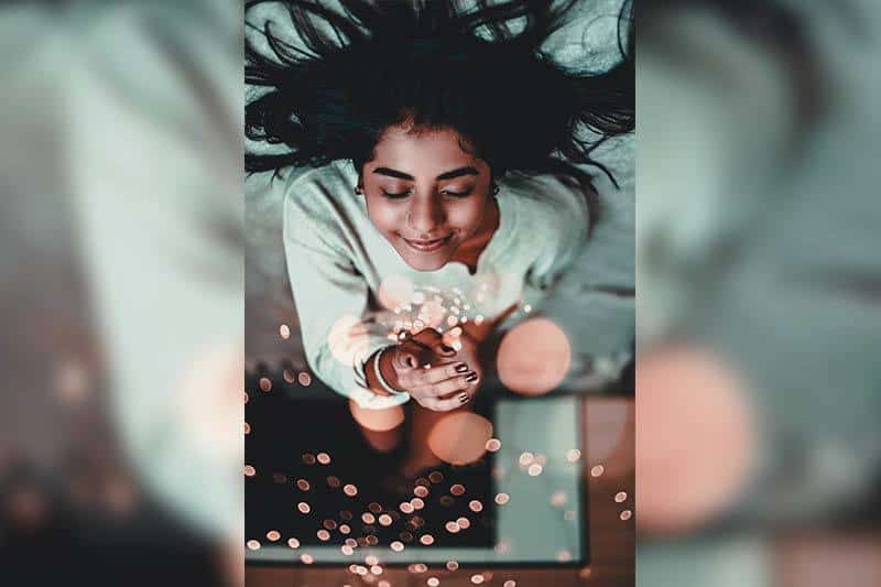 happy woman on bed