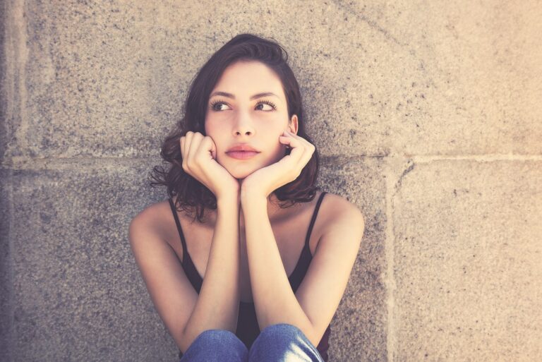 serious beautiful woman sitting outdoor
