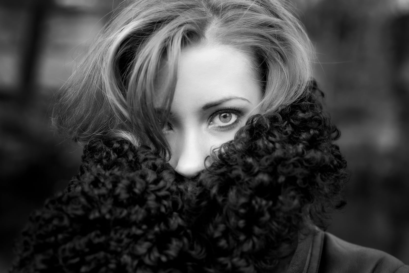 Black and white outdoor portrait of young woman