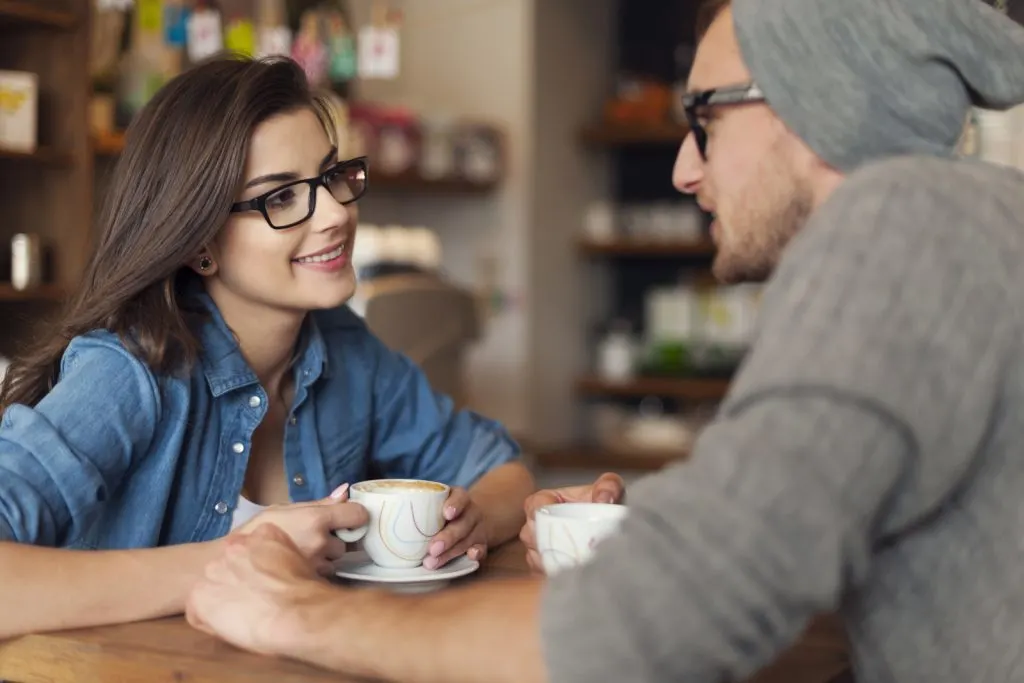 a couple on a date at a coffee shop