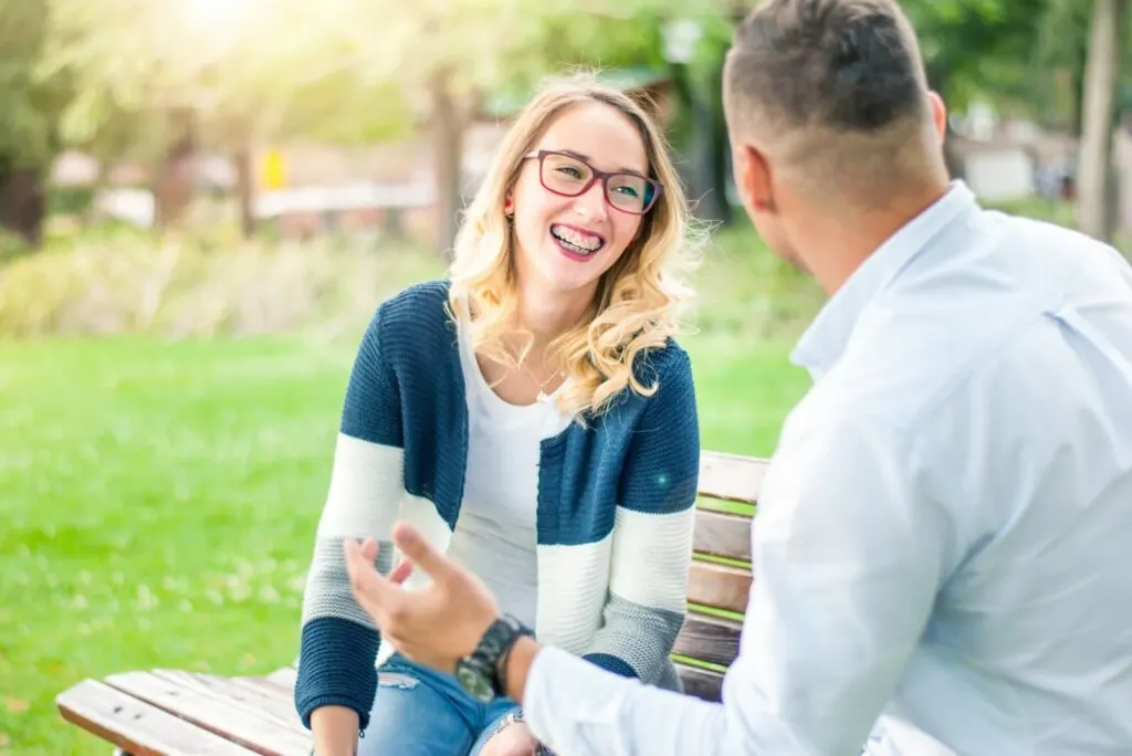 a couple talking in the park