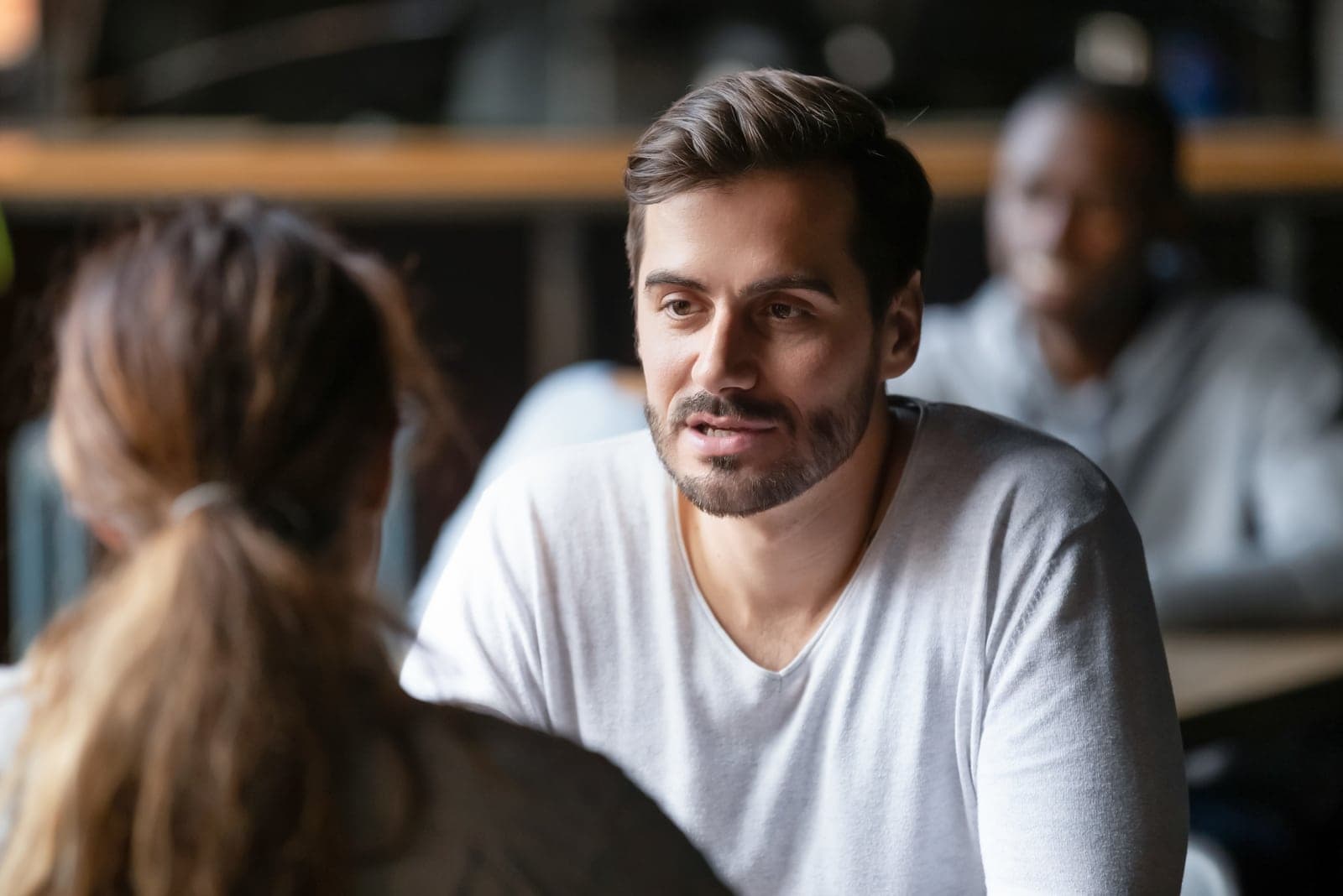 a man talking to a woman