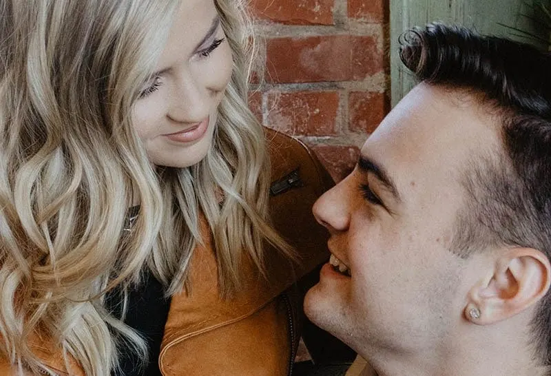 close up of smiling couple looking each other