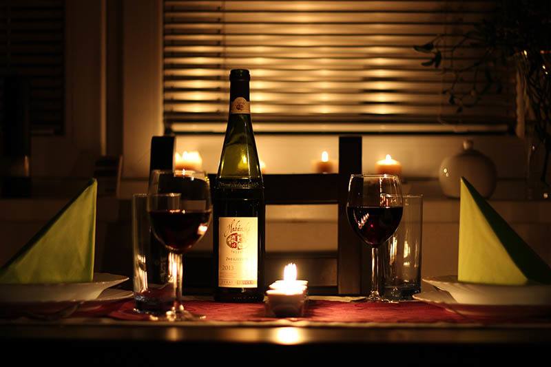 photo of candles and wine