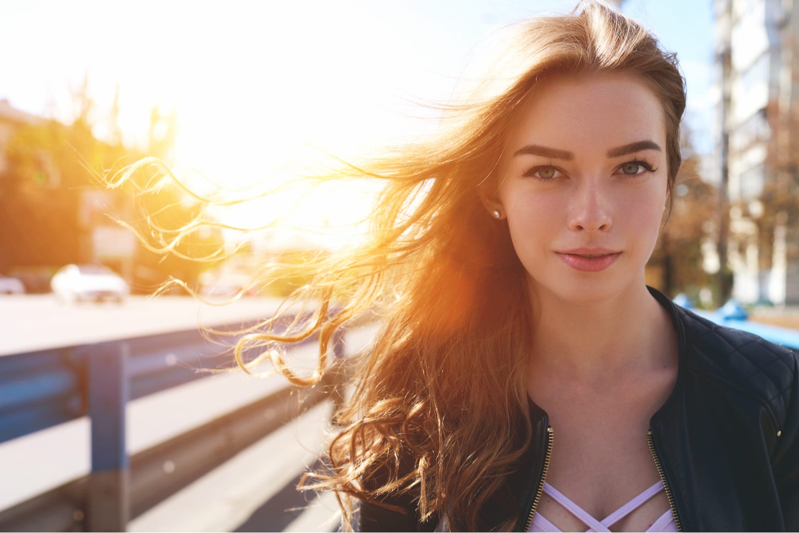 portrait of an attractive smiling girl at sunset