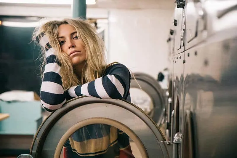 sad blond woman sitting on chair