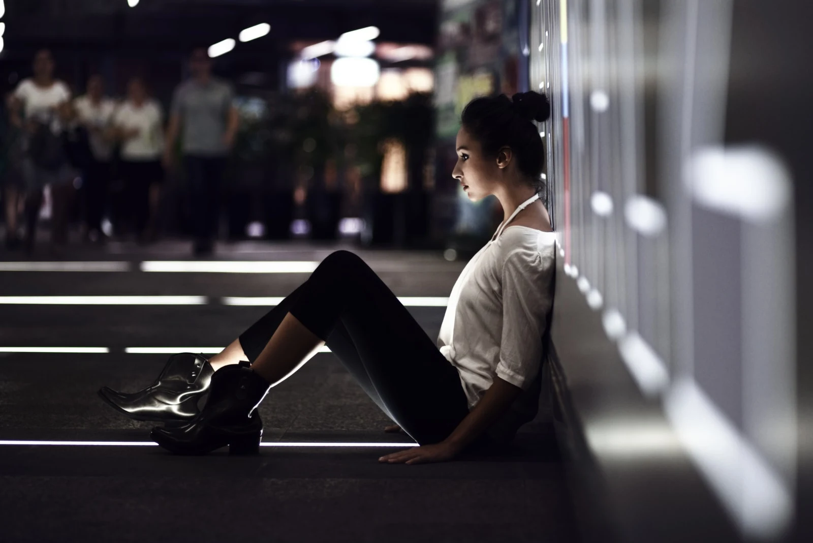 sad lonely woman sitting on stairs outdoor