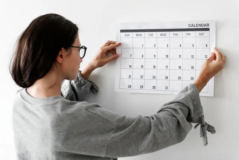 young woman holding a calendar