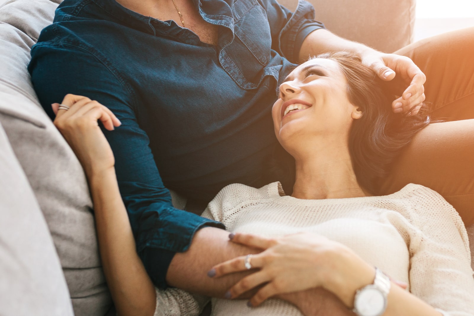 young woman hugging with a man and smile