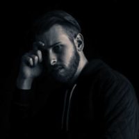 black and white photo of thoughtful man