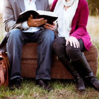 man reading poems to woman