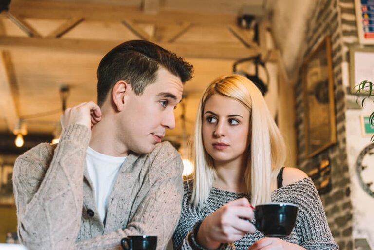 man talking to serious woman
