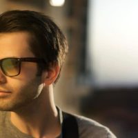 man with sunglasses looking away