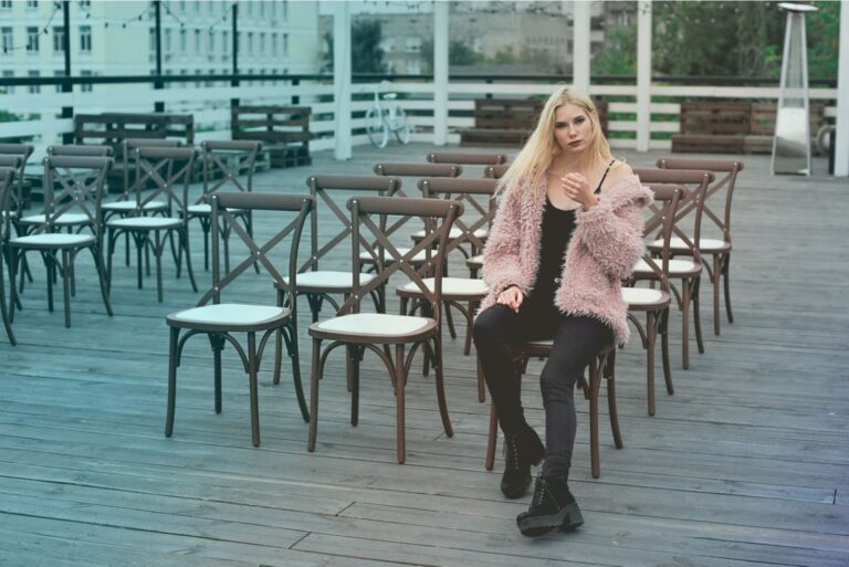 woman sitting on chair outside