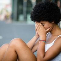 sad woman sitting on the floor