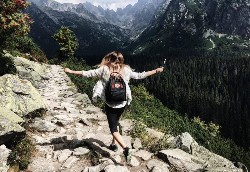 adventure woman walking on mountain